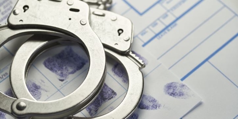 handcuffs on fingerprint documents